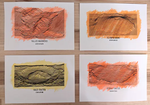 Four postcards showing ridge maps of Mars landmarks with coloured watercolour backgrounds. The landmarks are Olympus Mons, Valles Marineris, Gale Crater and Jezero Crater